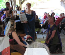 picture of the Hobbe being invested by Queen Marguerite as Her Champion